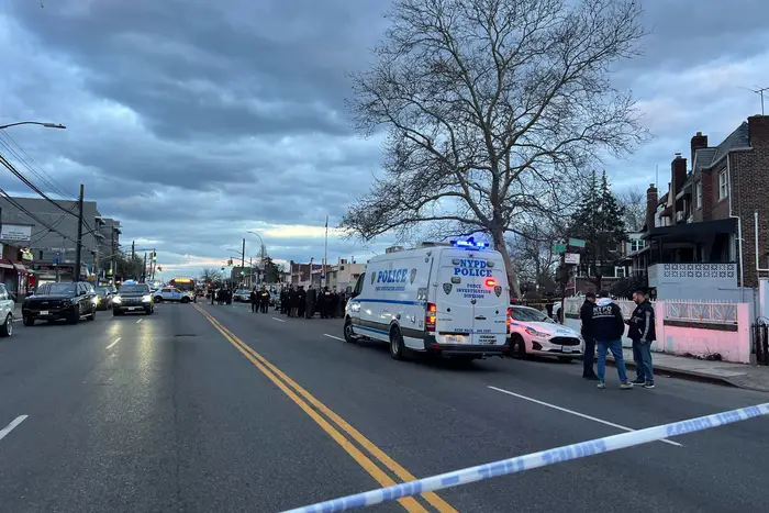 Police respond to a shooting in Brooklyn on Monday.